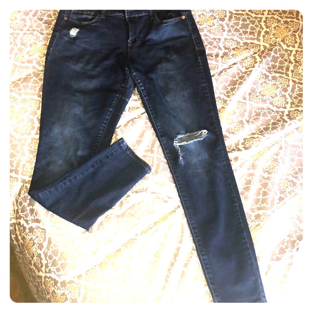 Distressed dark jeans